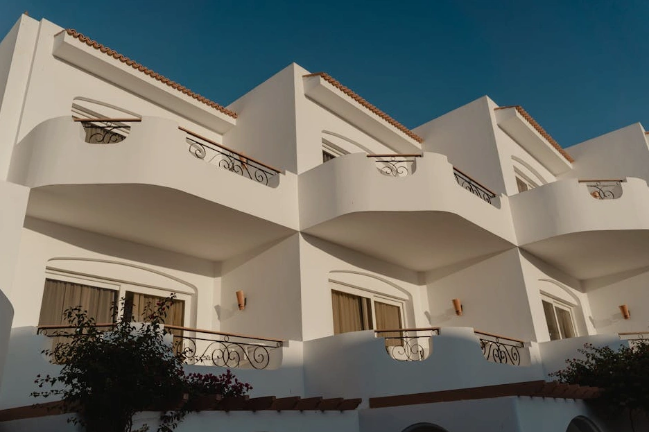 The modern glass facade of a university or financial institution building.